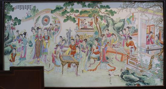 A large Chinese plaque of ladies in a garden